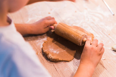 Cropped hands of person preparing food