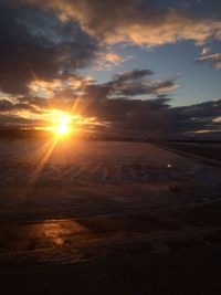 Scenic view of landscape against sky during sunset