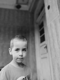 Portrait of boy standing outdoors