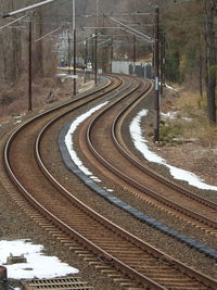 High angle view of curve railroad tracks