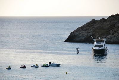 Nautical vessel on sea against clear sky
