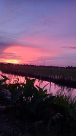 Scenic view of lake against sky during sunset