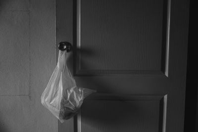 Plastic bag hanging on door