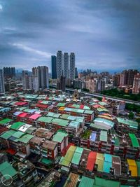 High angle view of buildings in city against sky