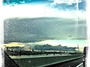 View of road against cloudy sky