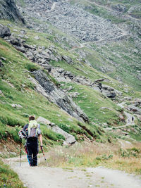 Rear view of woman standing on landscape
