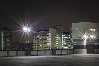 Illuminated buildings in city at night