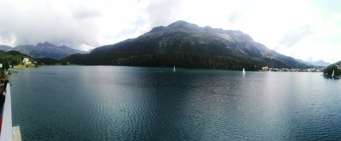 Scenic view of lake and mountains against sky