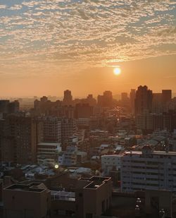 High angle view of cityscape against sky during sunset