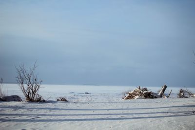 Scenic view of frozen lake against sky