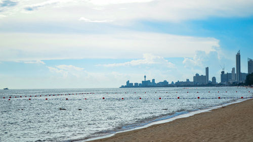 Panoramic view of beach against cloudy sky