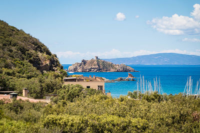 Scenic view of sea and buildings against sky