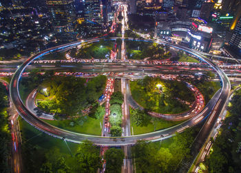 High angle view of light trails on highway at night