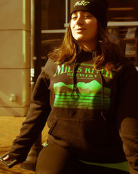 Woman looking away while sitting at home