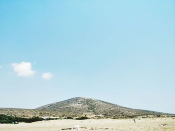 View of desert against blue sky
