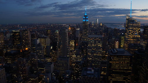 Aerial view of illuminated buildings in city