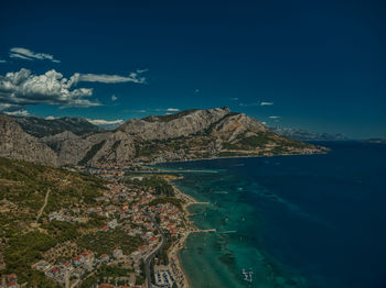 Scenic view of sea and mountains against blue sky croatia