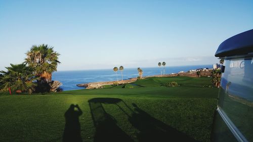 Scenic view of sea against clear blue sky