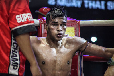 Shirtless man in boxing ring