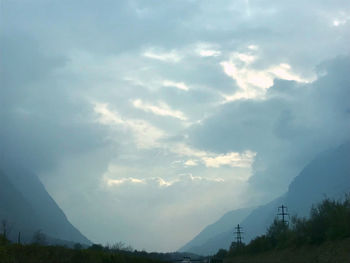 Scenic view of silhouette mountains against sky