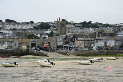 Boats moored at harbor