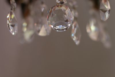 Close-up of crystal ball hanging on glass