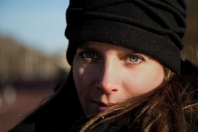 Close-up portrait of woman in winter