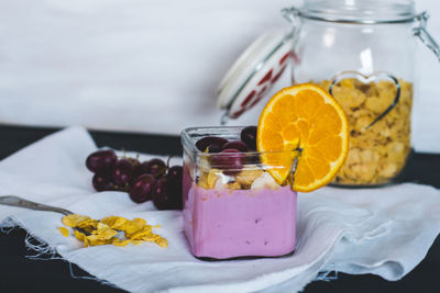 Close-up of drink in glass jar on table