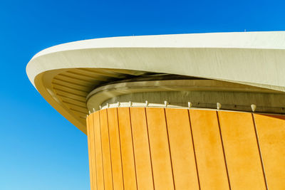 Low angle view of building against clear blue sky