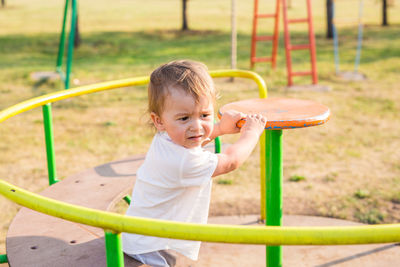 Happy boy playing on playground