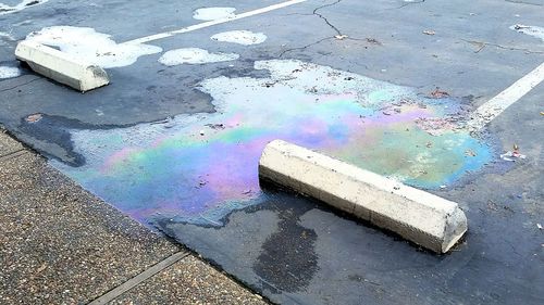 High angle view of puddle on street