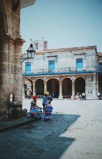 People in front of historical building