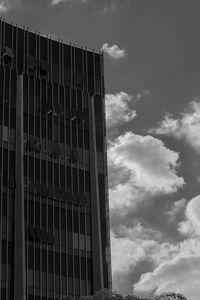 Low angle view of building against cloudy sky