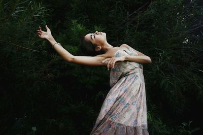 Woman walking on grassy field