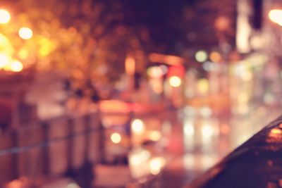 Defocused image of illuminated city at night