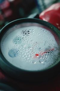 High angle view of wet drink in glass