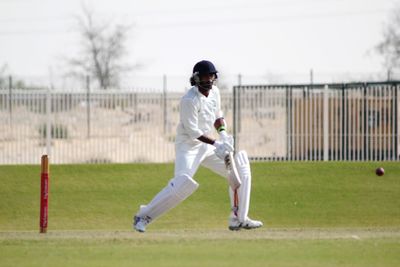 Full length of boy playing on field