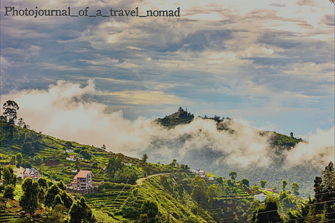 SCENIC VIEW OF MOUNTAINS AGAINST CLOUDY SKY