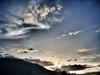 Low angle view of silhouette mountain against sky during sunset