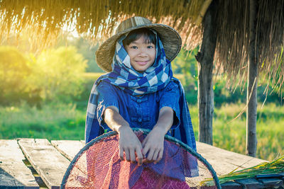Portrait of smiling girl standing in farm