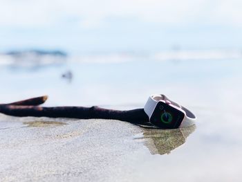 Close-up of umbrella on beach