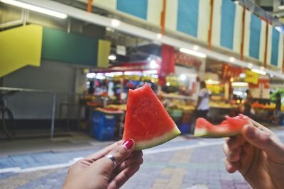 Close-up of hand holding watermelon