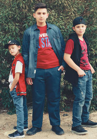 Full length portrait of boy standing outdoors