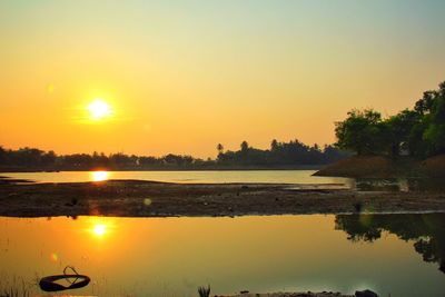 Scenic view of sunset over river