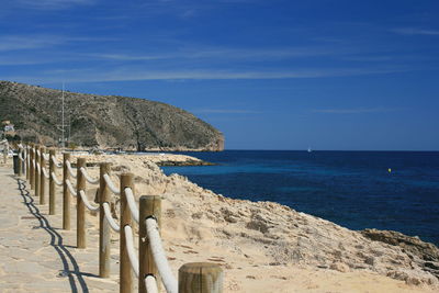 Scenic view of sea against blue sky