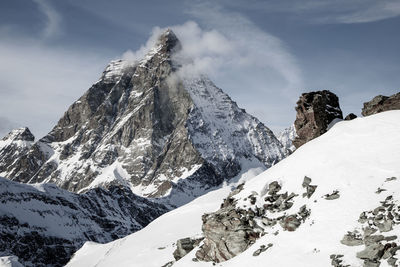 Scenic view of snowcapped mountains against sky