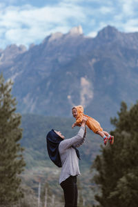 Full length of person standing on land against mountains