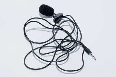 High angle view of electric lamp against white background