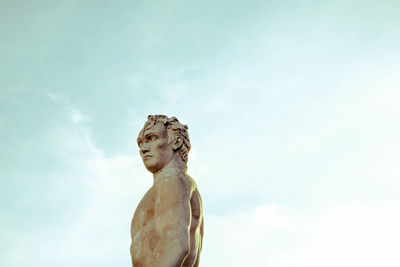 Low angle view of statue against sky