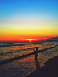 Scenic view of sea at sunset